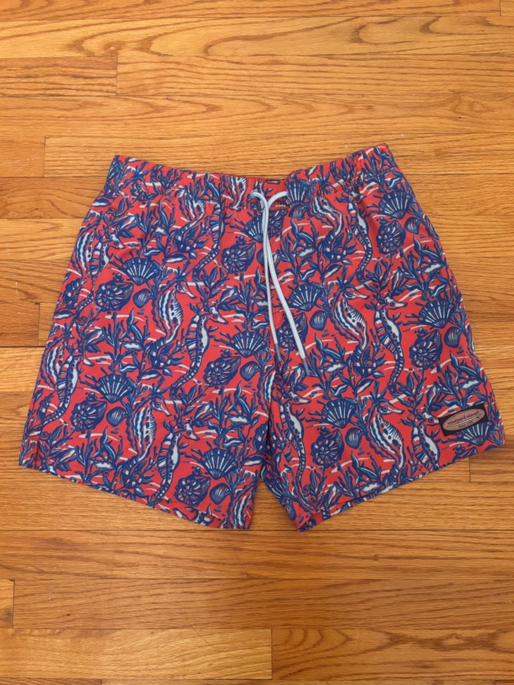 Vineyard Vines Coral Swim Trunks with Blue Tropical Print